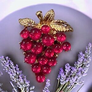 Elegant Gold and Red Grape Brooch